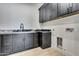 Laundry room featuring modern cabinets with granite counters at 36321 N 16Th St, Phoenix, AZ 85086