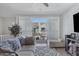 Living room with slider leading to balcony with community views at 4020 E Toledo St # 103, Gilbert, AZ 85295