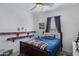 Cozy bedroom features a blue accent wall, carpeted floors, and ample natural light at 4020 E Toledo St # 103, Gilbert, AZ 85295