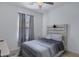 Inviting bedroom with a queen bed, neutral-toned bedding and a ceiling fan at 4020 E Toledo St # 103, Gilbert, AZ 85295