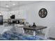 Open concept kitchen and dining area with sleek countertops and natural light at 4020 E Toledo St # 103, Gilbert, AZ 85295