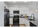 Well-equipped kitchen with stainless steel appliances, sleek cabinetry and modern faucet at 4020 E Toledo St # 103, Gilbert, AZ 85295