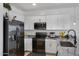 Charming kitchen featuring stainless steel appliances, white cabinets and stylish countertops at 4020 E Toledo St # 103, Gilbert, AZ 85295