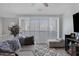 Upstairs living room with neutral colors and slider to balcony at 4020 E Toledo St # 103, Gilbert, AZ 85295