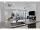 Open-concept kitchen, dining and living room is perfect for entertaining and modern living at 4020 E Toledo St # 103, Gilbert, AZ 85295