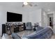 Comfortable living space featuring a sleek entertainment unit and plush seating at 4020 E Toledo St # 103, Gilbert, AZ 85295