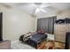Bedroom with tile flooring, ceiling fan, dresser, and ample space, ready for personalization at 4020 W Tuckey Ln, Phoenix, AZ 85019