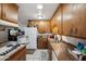Vintage kitchen features tiled floor, wood countertops and cabinets, and a functional layout at 4020 W Tuckey Ln, Phoenix, AZ 85019