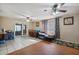Bright living room with tile flooring, dining area, large windows and ceiling fans at 4020 W Tuckey Ln, Phoenix, AZ 85019