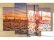 A multi-paneled desert landscape artwork with saguaro cacti and a vibrant sunset sky adorns the wall at 4245 N 16Th Dr, Phoenix, AZ 85015