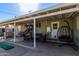 Inviting covered back patio with outdoor furniture and backyard games at 4245 N 16Th Dr, Phoenix, AZ 85015