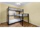 Bedroom featuring a twin-over-twin bunk bed, natural light, and laminate flooring for a space at 4245 N 16Th Dr, Phoenix, AZ 85015