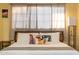 Comfortable bedroom with a stylish bed, decorative pillows, and soft lighting provides a serene atmosphere at 4245 N 16Th Dr, Phoenix, AZ 85015