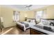 This bedroom has two beds, hardwood floors, and is painted a cheerful yellow at 4245 N 16Th Dr, Phoenix, AZ 85015