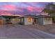 Charming single-story home with a covered carport and a well-maintained front yard and driveway at 4245 N 16Th Dr, Phoenix, AZ 85015