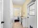 Hallway featuring built-in cabinets, counter space, and doorway to bedroom and back entrance at 4245 N 16Th Dr, Phoenix, AZ 85015