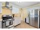 Well-equipped kitchen with stainless steel appliances and white cabinetry at 4245 N 16Th Dr, Phoenix, AZ 85015