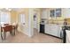 Eat-in kitchen features stainless steel appliances, light cabinets, and sunny breakfast nook at 4245 N 16Th Dr, Phoenix, AZ 85015