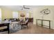 Comfortable living room features a game table, tile flooring, and natural light at 4245 N 16Th Dr, Phoenix, AZ 85015