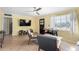 Cozy living room features stylish furniture, a ceiling fan, and a large window with natural light at 4245 N 16Th Dr, Phoenix, AZ 85015
