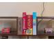 Close-up of shelf showcasing classic board games like Monopoly, Catan, and The Game of Life at 4245 N 16Th Dr, Phoenix, AZ 85015