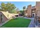 A tranquil backyard featuring an outdoor dining area and comfortable lounge seating, perfect for relaxation and entertainment at 4434 E Camelback Rd # 132, Phoenix, AZ 85018