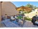 An inviting backyard with comfortable seating around a fire pit and patio, designed for relaxation and social gatherings at 4434 E Camelback Rd # 132, Phoenix, AZ 85018