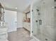 Elegant bathroom with a glass enclosed walk-in shower and double sink vanity with a large mirror at 4434 E Camelback Rd # 132, Phoenix, AZ 85018