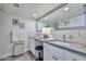 Bright bathroom with double sinks, modern fixtures, vanity, framed mirror, and decorative accents for a luxurious feel at 4434 E Camelback Rd # 132, Phoenix, AZ 85018