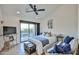 Stylish bedroom with a dark ceiling fan and decorative trunk at the foot of the bed at 4434 E Camelback Rd # 132, Phoenix, AZ 85018