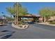 A gated community entrance adorned with lush landscaping and mature trees, offering privacy and security at 4434 E Camelback Rd # 132, Phoenix, AZ 85018
