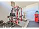 Home gym with high ceilings, Peloton bike, weight rack, and exercise equipment for a comprehensive workout space at 4434 E Camelback Rd # 132, Phoenix, AZ 85018