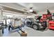 A spacious garage with ample storage, work space, and a car with its hood open for maintenance at 4434 E Camelback Rd # 132, Phoenix, AZ 85018