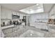 Spacious kitchen with granite countertops, stainless steel appliances, and a bright skylight at 4434 E Camelback Rd # 132, Phoenix, AZ 85018
