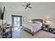 Comfortable main bedroom with a private balcony, neutral decor, and stylish furnishings at 4434 E Camelback Rd # 132, Phoenix, AZ 85018
