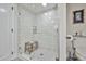 Modern shower with glass enclosure, subway tile, a rainfall showerhead, and a built-in bench, offering a spa-like experience at 4434 E Camelback Rd # 132, Phoenix, AZ 85018