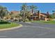 A street view showcasing the community landscaping and distant mountain views at 4434 E Camelback Rd # 132, Phoenix, AZ 85018