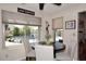 Cozy dining area offering backyard views of a beautiful pool, elegant seating, and lots of light at 5879 E Marconi Ave, Scottsdale, AZ 85254