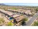 Desert community aerial showcasing pool, solar panels and tiled roofs nestled among desert landscaping at 6620 S Front Nine Dr, Gold Canyon, AZ 85118