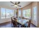 Bright dining room with large windows and a granite top table with seating for six at 6620 S Front Nine Dr, Gold Canyon, AZ 85118