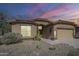 Charming single-story home with a tile roof, desert landscaping, and an attached two-car garage at 6620 S Front Nine Dr, Gold Canyon, AZ 85118
