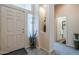 Warm and welcoming foyer featuring neutral tones, tiled floors and an umbrella stand at 6620 S Front Nine Dr, Gold Canyon, AZ 85118