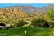 Rolling green golf course with desert views and mountain backdrop at 6620 S Front Nine Dr, Gold Canyon, AZ 85118