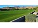Lush green community greenspace with picnic tables and mountain views at 6620 S Front Nine Dr, Gold Canyon, AZ 85118