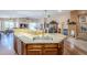 Open kitchen island featuring granite countertops and a sink, seamlessly connected to dining at 6620 S Front Nine Dr, Gold Canyon, AZ 85118