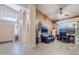 Open-concept living area with tile flooring, featuring a view of the foyer and a cozy seating area at 6620 S Front Nine Dr, Gold Canyon, AZ 85118