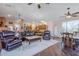 Spacious living room featuring hardwood floors, leather seating and an open concept layout at 6620 S Front Nine Dr, Gold Canyon, AZ 85118