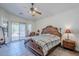 Main bedroom featuring a spacious layout, ceiling fan, and private outdoor access at 6620 S Front Nine Dr, Gold Canyon, AZ 85118
