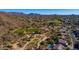 Aerial view of community, showing homes and golf course amid natural desert landscape at 7304 E Northridge Cir, Mesa, AZ 85207