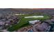 Aerial view of homes bordering well-manicured golf course and serene lakes at 7304 E Northridge Cir, Mesa, AZ 85207